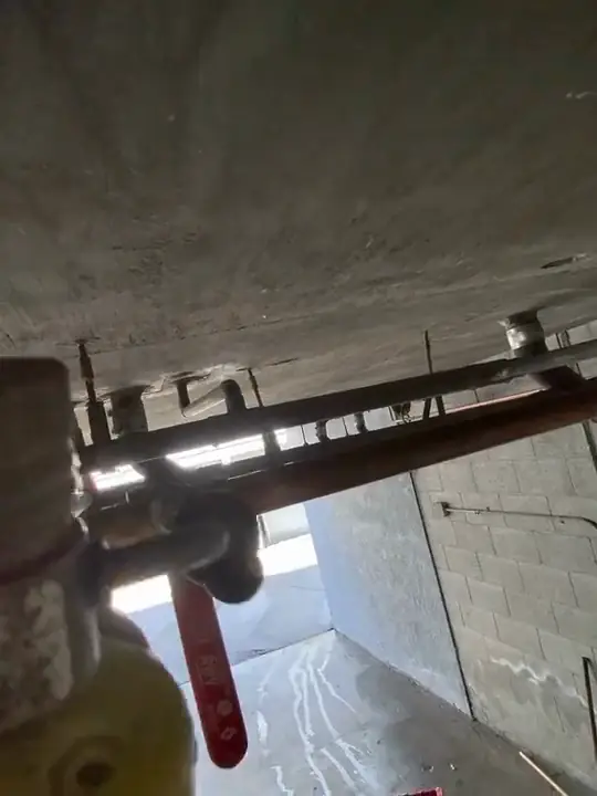 Through Jacob's glasses: looking up at pipe work under an overhang
